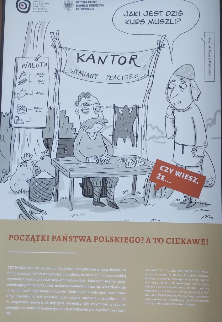 Tabliczka w Gnieźnie opisująca pierwsze metody płatności - m.in. za pomocą muszli.